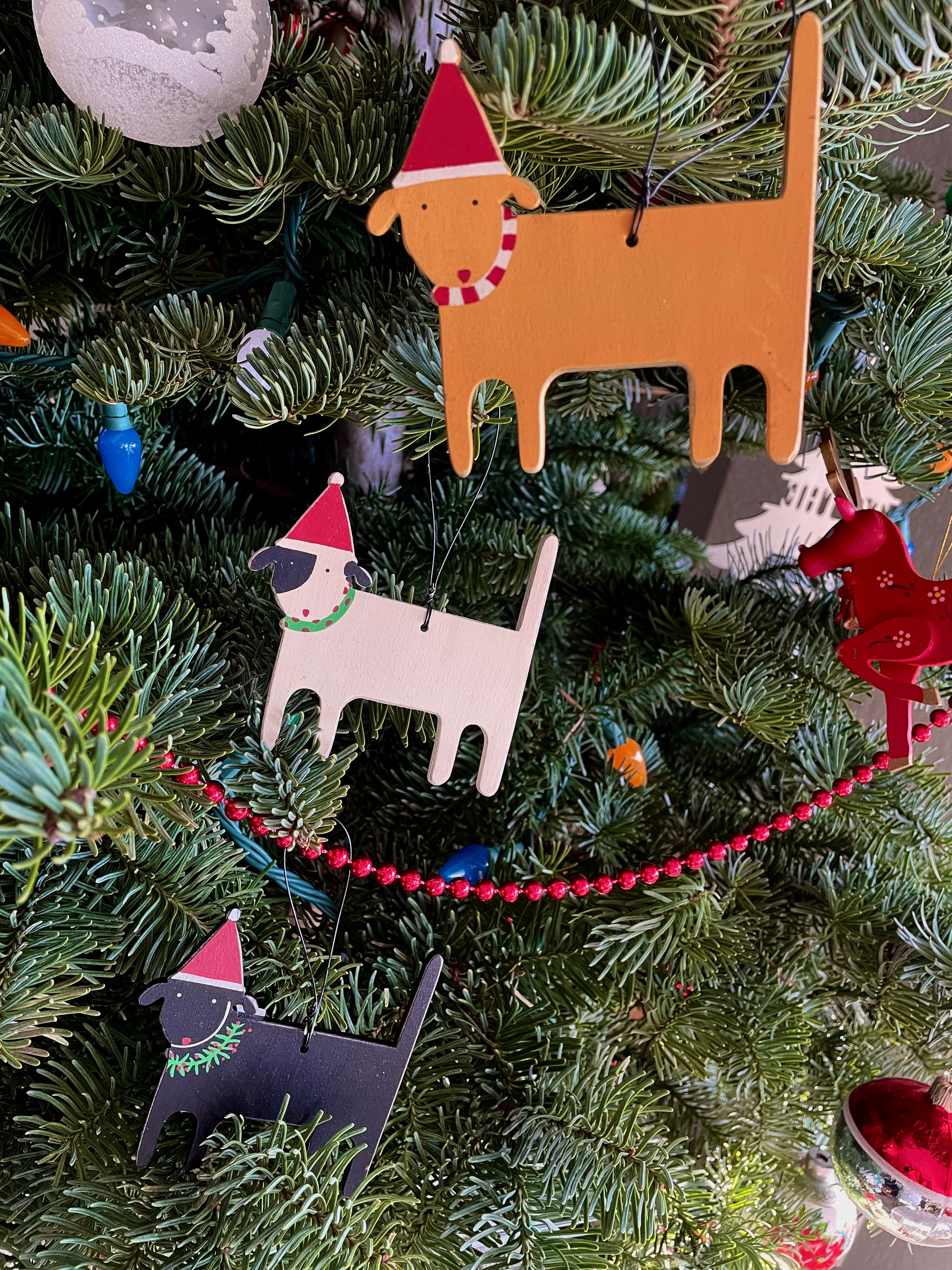 The Canton Christmas Shop Christmas Dog Ornament Assorted Colors of Black White Yellow with festive scarves wire hanger