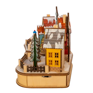 The Canton Christmas Shop 7" Battery Operated LED Christmas Village with Musical Tree by Kurt Adler