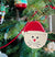 The Canton Christmas Shop Santa hat Cat Christmas Ornament with glittery snow made of wood with wire hanger on Christmas tree