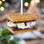 The Canton Christmas Shop S'mores ornament held by customer