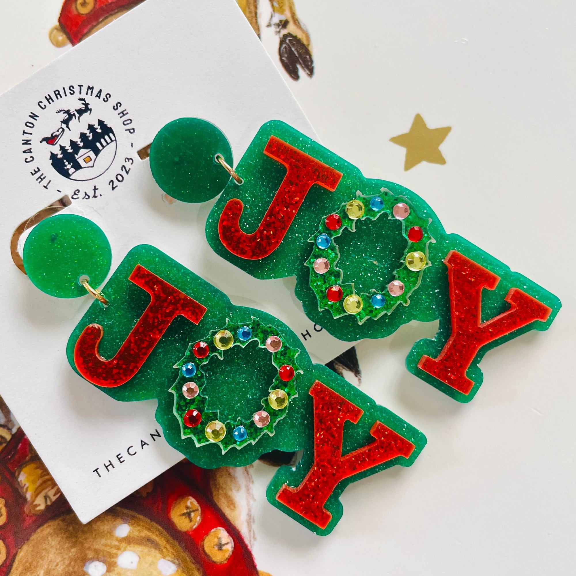 The Canton Christmas Shop Joy Christmas Wreath Glitter Acetate Earrings for holiday fun celebrations resin rhinestone glitter