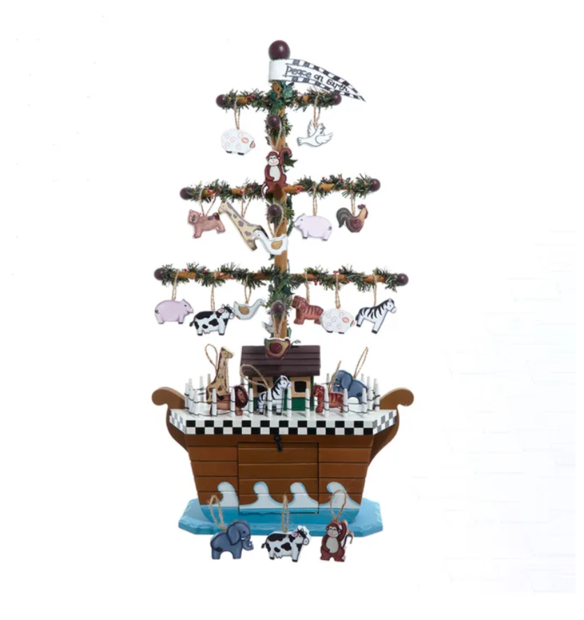 The Canton Christmas Shop Noah's ark with wooden animals for Christmas and Christian tabletop display sitting on water with a rainbow of promise