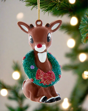 The Canton Christmas Shop Rudolph the red nosed reindeer with wreath ornament by Kurt Adler hanging on christmas tree branch