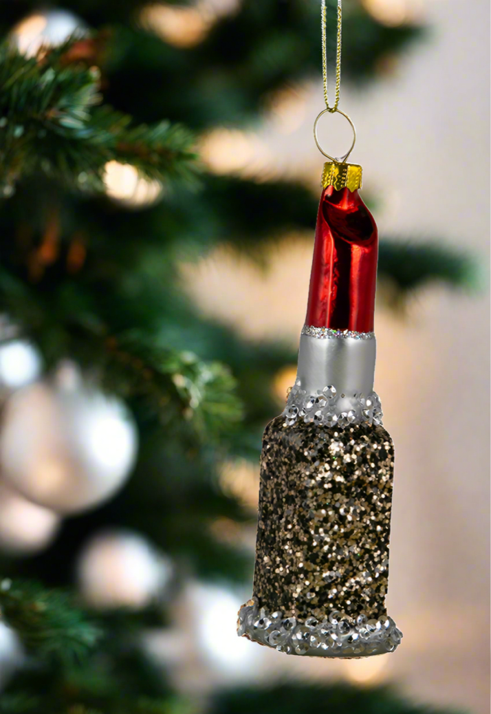 The Canton Christmas Shop Red Lipstick Glass Ornament hanging on tree