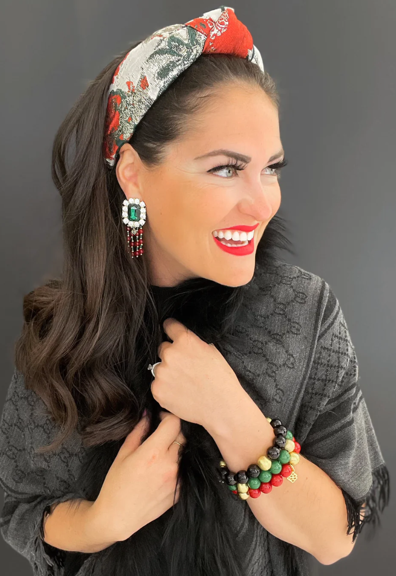 The Canton Christmas Shop Winter Poinsettia Brocade Headband worn by Brianna Cannon for holiday parties entertaining Christmas celebrations