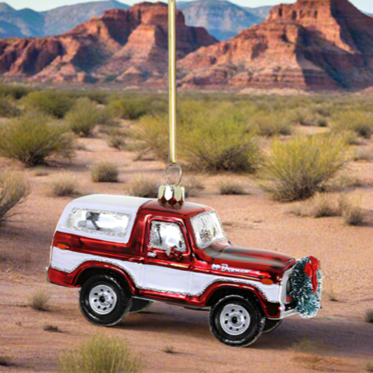 The Canton Christmas Shop Christmas Bronco by Cody Foster &amp; Co Glass Ornament in Arizona desert