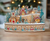 The Canton Christmas Shop Kurt Adler 11.2" Battery Operated Light Up Christmas Village with Santa in living room