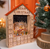 19" Lit Advent Calendar House with Nativity and Orange Roof by Kurt Adler on table