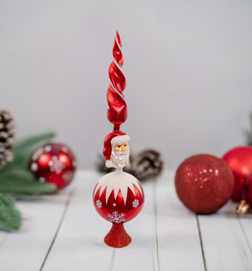 he Canton Christmas Shop 15 3/4&quot; Red Santa Decorative Glass Tree Topper on table with ornaments