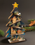 The Canton Christmas Shop Battery-Operated Light-Up LED Blue Wooden Christmas Tree with Village Scene Carved Animals Nature Wildlife Skiing Sledding Church in Shop