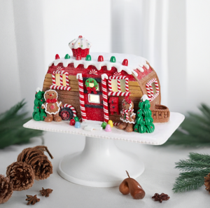 The Canton Christmas Shop 6" Gingerbread Camper LED House by Kurt Adler on pedestal