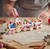 The Canton Christmas Shop 14.4" Gingerbread Claydough Train Set by Kurt Adler on kitchen counter