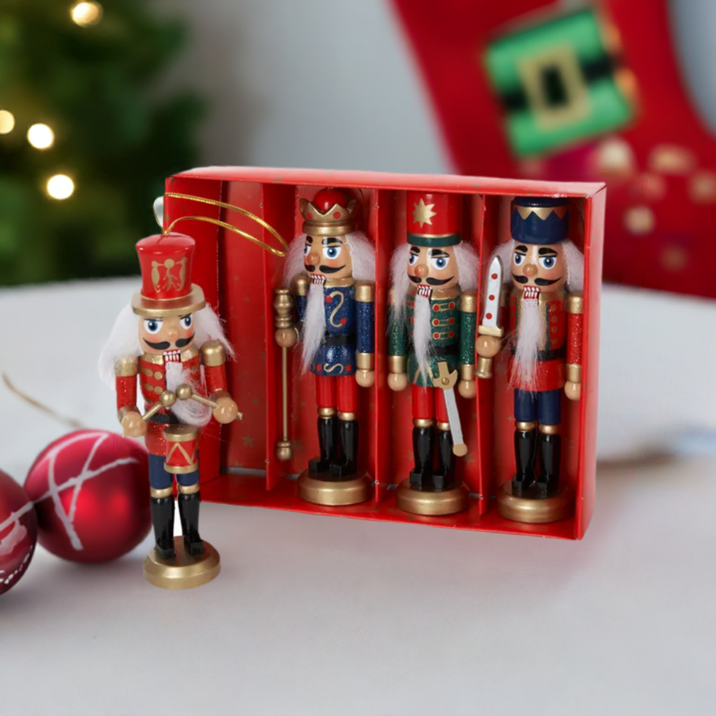 The Canton Christmas Shop 5&quot; wooden nutcracker ornaments four piece set with christmas tree and stocking in background