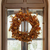 The Canton Christmas Shop 24" Pre-lit Gold Foil Wreath on door