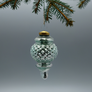 The Canton Christmas Shop Aqua Glass Finial Ornament hanging from tree branch