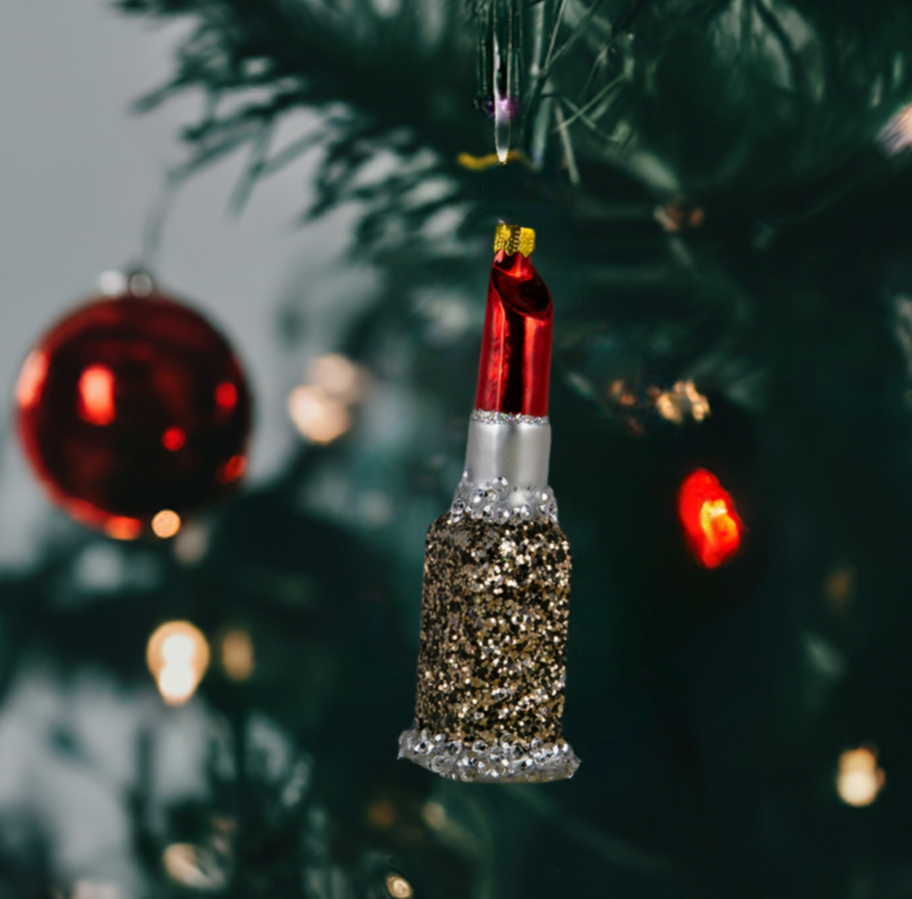 The Canton Christmas Shop Red Lipstick Glass Ornament hanging on tree