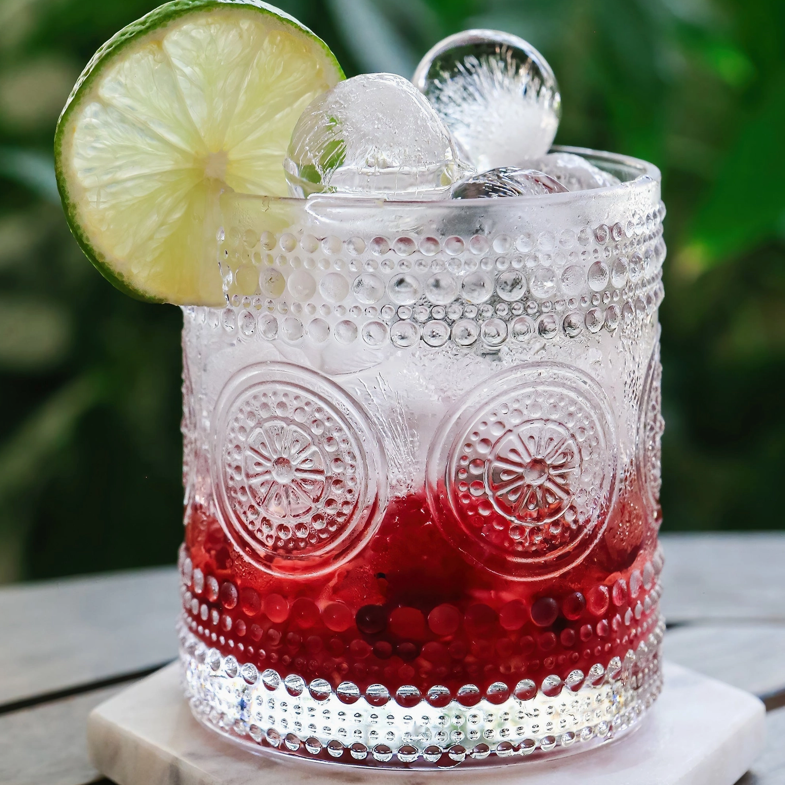 The Canton Christmas shop 10 oz medallion hobnail clear old fashioned whiskey glasses set of 6 with cranberry drink and lime wedge